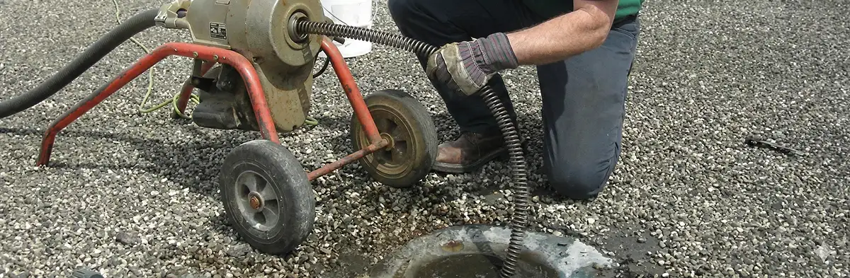 sewer rodding technician actively removing blockages from a sewer line in Phoenix, AZ
