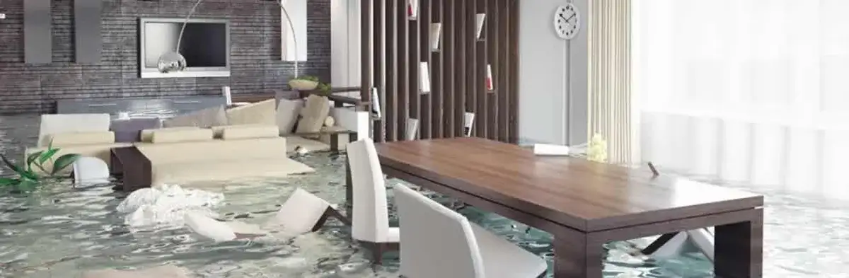home interior affected by water damage with flooded floors and displaced furniture in Phoenix, AZ